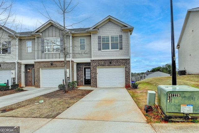 5831 Taka Ln, Lithonia, GA 30038 - multi unit property with brick siding, an attached garage, driveway, and central air condition unit