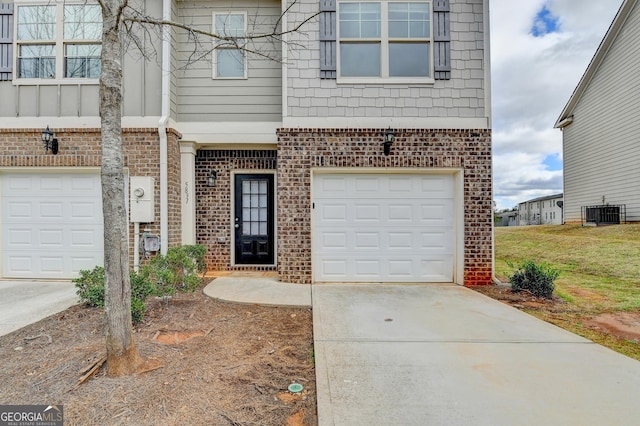 5831 Taka Ln, Lithonia, GA 30038 - view of front facade with brick siding, driveway, and a garage