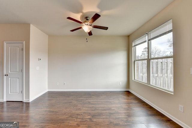 5831 Taka Ln, Lithonia, GA 30038 - spare room featuring ceiling fan, dark wood finished floors, and baseboards
