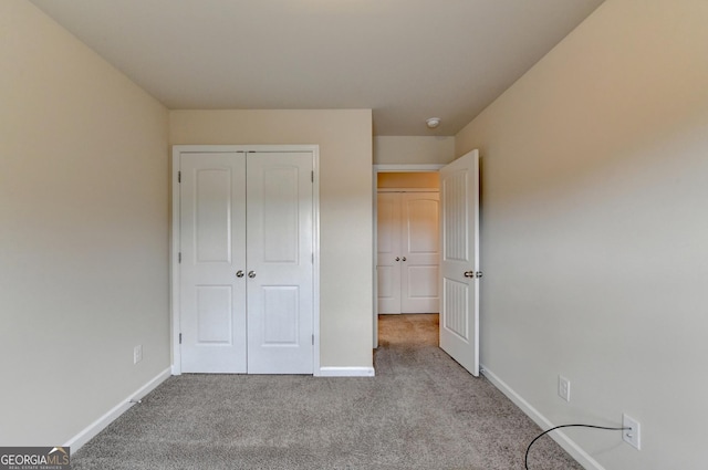 5831 Taka Ln, Lithonia, GA 30038 - unfurnished bedroom with carpet floors, baseboards, and a closet