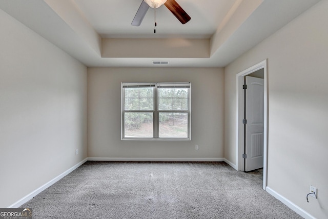 5831 Taka Ln, Lithonia, GA 30038 - carpeted spare room featuring ceiling fan, baseboards, and a raised ceiling