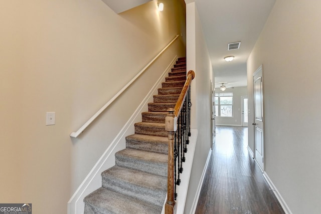 5831 Taka Ln, Lithonia, GA 30038 - staircase with wood finished floors, a ceiling fan, and baseboards