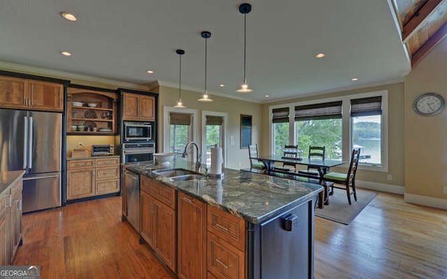 2156 Mockingbird Ln, Hiawassee, GA 30546 - kitchen with stainless steel appliances, a sink, open shelves, wood finished floors, and brown cabinetry