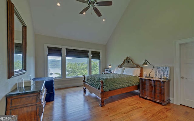 2156 Mockingbird Ln, Hiawassee, GA 30546 - bedroom featuring multiple windows, high vaulted ceiling, light wood-type flooring, and ceiling fan