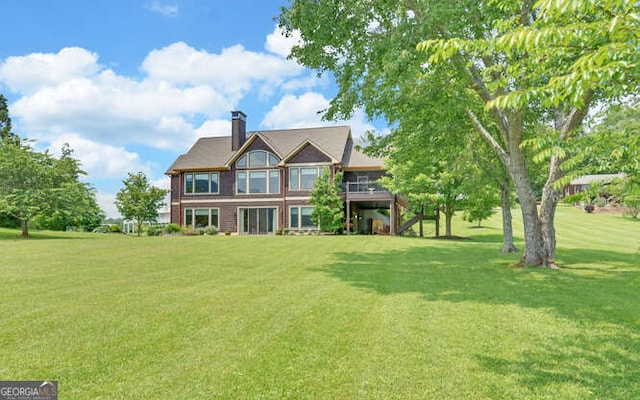 2156 Mockingbird Ln, Hiawassee, GA 30546 - view of front of property with a front lawn, a wooden deck, stairs, and a chimney