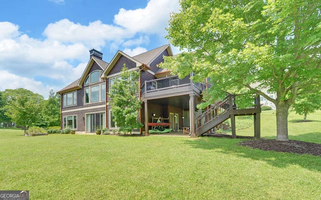 2156 Mockingbird Ln, Hiawassee, GA 30546 - back of house featuring a wooden deck, a lawn, stairway, and a chimney