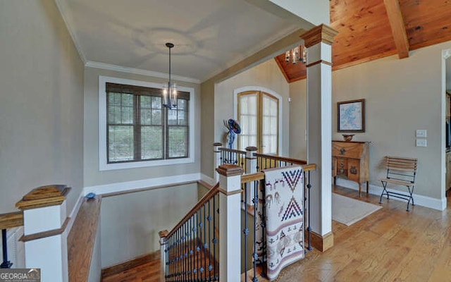 2156 Mockingbird Ln, Hiawassee, GA 30546 - hall featuring an upstairs landing, a chandelier, crown molding, wood finished floors, and baseboards