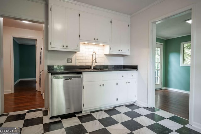 140 Lakeview St, Athens, GA 30601 - kitchen featuring dishwasher, dark countertops, white cabinets, tile patterned floors, and ornamental molding