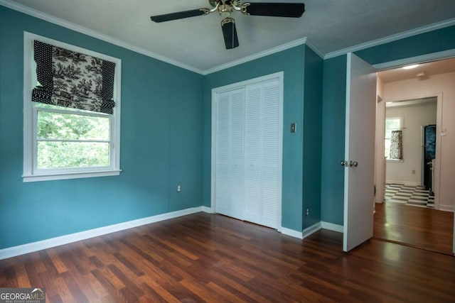 140 Lakeview St, Athens, GA 30601 - unfurnished bedroom with wood finished floors, a closet, crown molding, and ceiling fan