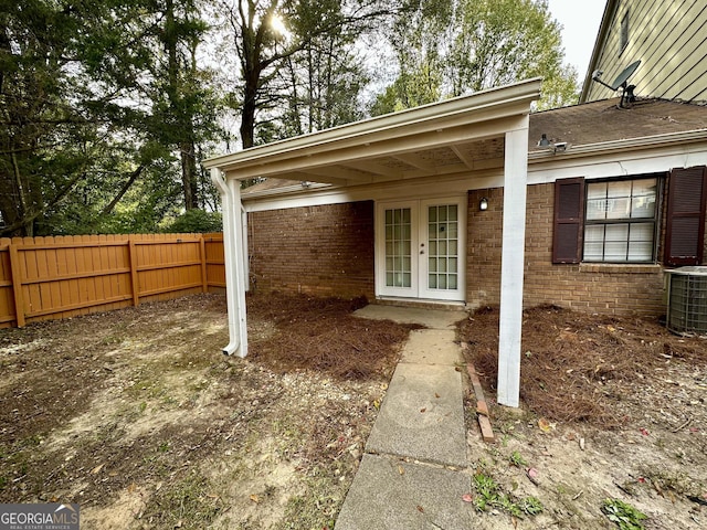 2566 Stratford Ln, Morrow, GA 30260 - doorway to property featuring french doors, cooling unit, and brick siding