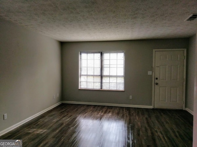 2566 Stratford Ln, Morrow, GA 30260 - empty room featuring baseboards, a textured ceiling, and dark wood-type flooring