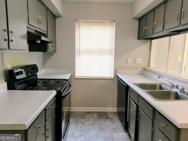 2566 Stratford Ln, Morrow, GA 30260 - kitchen featuring black appliances, under cabinet range hood, a sink, baseboards, and light countertops