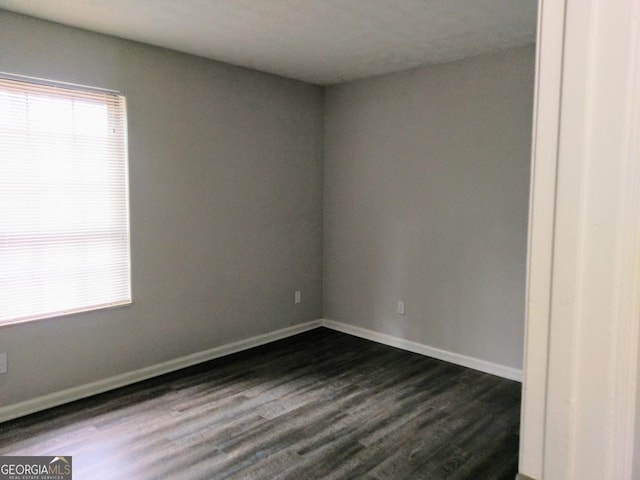 2566 Stratford Ln, Morrow, GA 30260 - unfurnished room featuring dark wood finished floors and baseboards