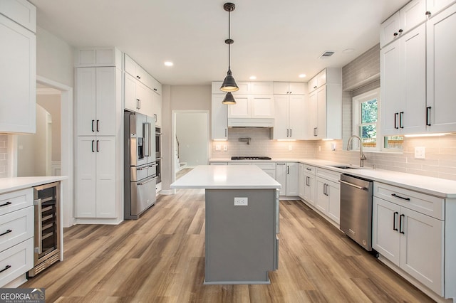 300 Windsor Chase Trl, Johns Creek, GA 30097 - kitchen featuring stainless steel appliances, a sink, wine cooler, decorative backsplash, and recessed lighting