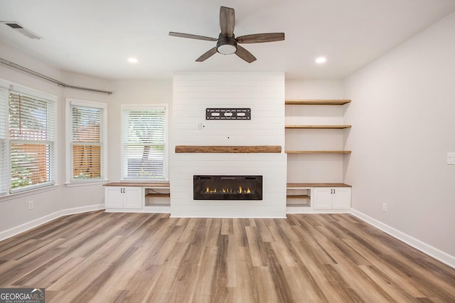 300 Windsor Chase Trl, Johns Creek, GA 30097 - unfurnished living room with light wood finished floors, baseboards, a ceiling fan, recessed lighting, and a fireplace