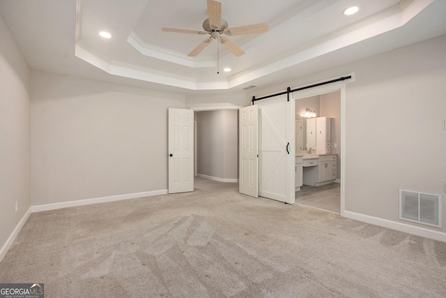300 Windsor Chase Trl, Johns Creek, GA 30097 - unfurnished bedroom featuring a raised ceiling, light colored carpet, a barn door, baseboards, and recessed lighting