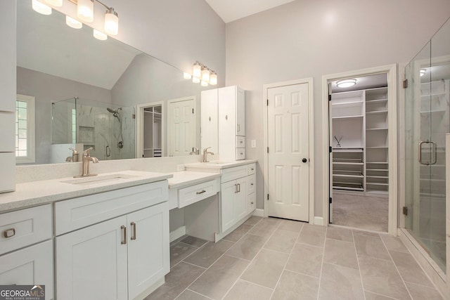 300 Windsor Chase Trl, Johns Creek, GA 30097 - bathroom featuring a spacious closet, vanity, a stall shower, and lofted ceiling