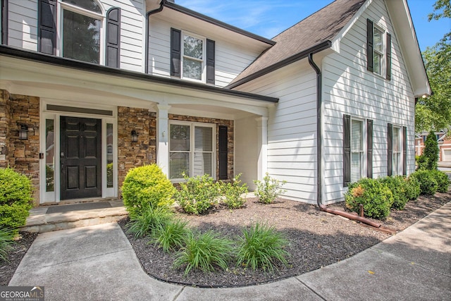 300 Windsor Chase Trl, Johns Creek, GA 30097 - property entrance featuring stone siding, a porch, and a shingled roof