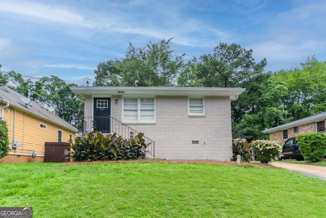 933 Capitol View Ave NW, Atlanta, GA 30318 - view of front of home with a front lawn, brick siding, and crawl space