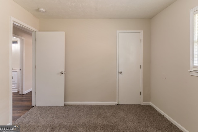933 Capitol View Ave NW, Atlanta, GA 30318 - unfurnished bedroom featuring carpet flooring