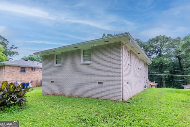933 Capitol View Ave NW, Atlanta, GA 30318 - view of side of home featuring a yard, brick siding, and crawl space