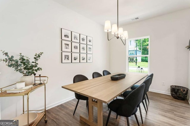 160 Winner St, Acworth, GA 30102 - dining space featuring wood finished floors, baseboards, and a chandelier