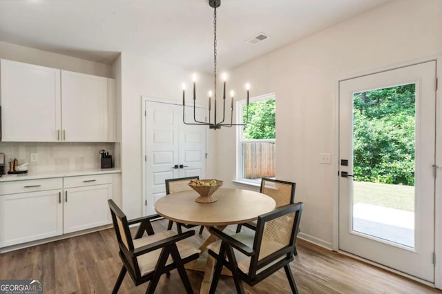 160 Winner St, Acworth, GA 30102 - dining space with a chandelier and wood finished floors