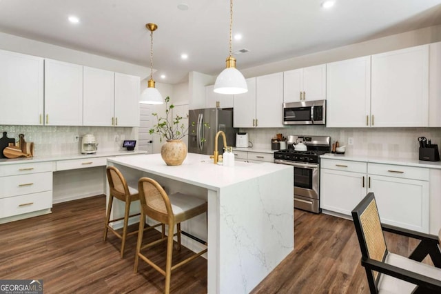 160 Winner St, Acworth, GA 30102 - kitchen featuring stainless steel appliances, tasteful backsplash, light countertops, dark wood-style flooring, and white cabinetry