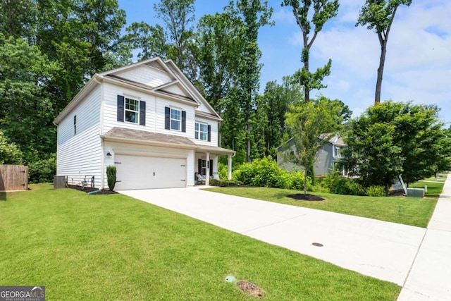 160 Winner St, Acworth, GA 30102 - view of front of home with an attached garage, driveway, a front lawn, and central AC