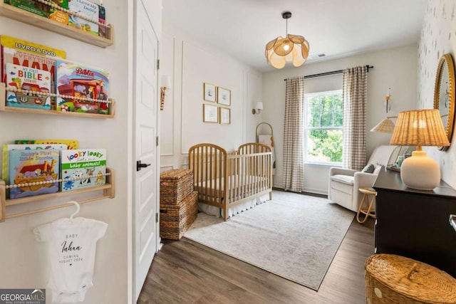 160 Winner St, Acworth, GA 30102 - bedroom featuring a nursery area and wood finished floors