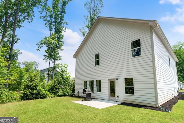 160 Winner St, Acworth, GA 30102 - rear view of house with a patio, a lawn, and central AC
