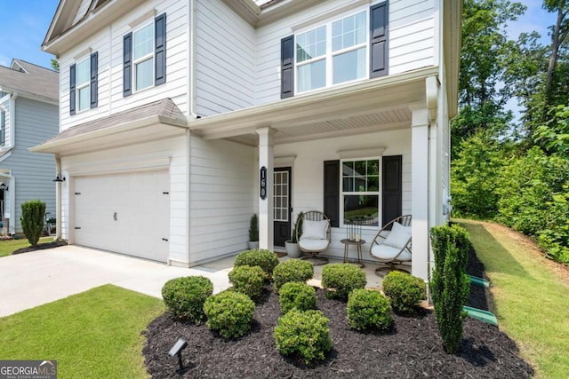 160 Winner St, Acworth, GA 30102 - view of front of house with covered porch, a garage, a front lawn, and concrete driveway