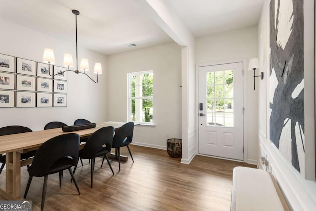 160 Winner St, Acworth, GA 30102 - dining area featuring wood finished floors, baseboards, and a chandelier
