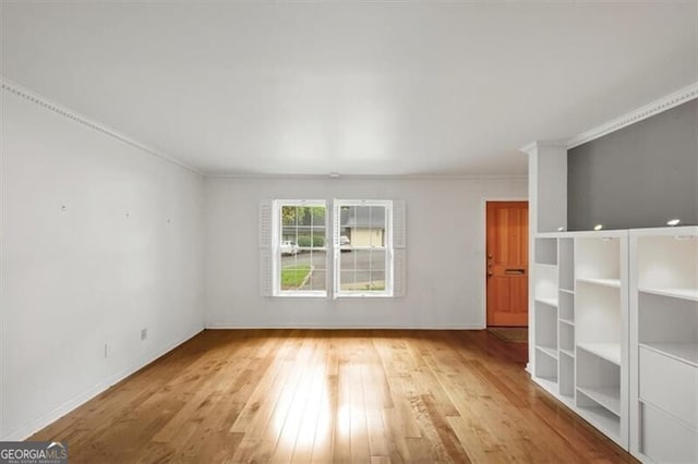 57 Cantey Pl NW, Atlanta, GA 30327 - unfurnished living room featuring hardwood / wood-style floors and crown molding
