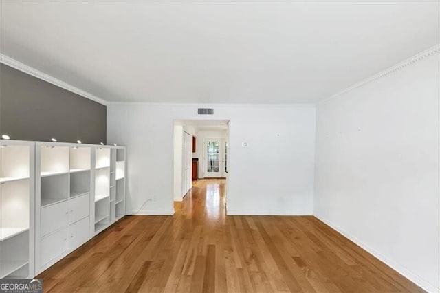 57 Cantey Pl NW, Atlanta, GA 30327 - unfurnished living room with ornamental molding and wood finished floors