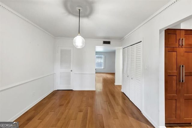 57 Cantey Pl NW, Atlanta, GA 30327 - unfurnished dining area with wood finished floors and crown molding