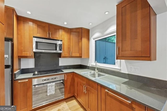57 Cantey Pl NW, Atlanta, GA 30327 - kitchen featuring stainless steel appliances, brown cabinets, and recessed lighting