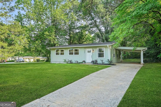 390 Lincoln Pl SW, Atlanta, GA 30315 - ranch-style home featuring concrete driveway, a front yard, an attached carport, and board and batten siding