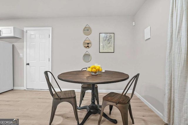 390 Lincoln Pl SW, Atlanta, GA 30315 - dining room with light wood-style floors and baseboards