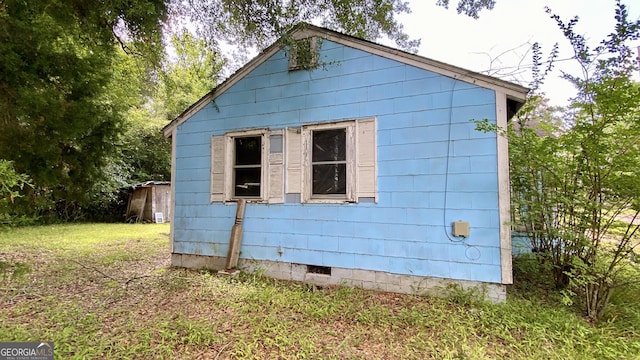 609 Virginia Cir, Montezuma, GA 31063 - view of side of property with crawl space