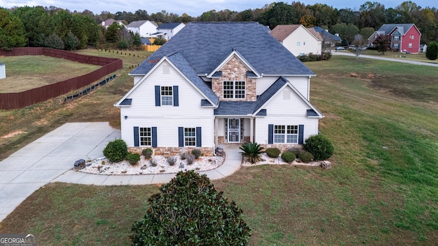 104 Hamilton Lake View Ct, Lagrange, GA 30241 - traditional-style home featuring stone siding, a front yard, and a shingled roof