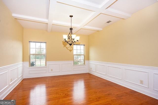104 Hamilton Lake View Ct, Lagrange, GA 30241 - unfurnished room with healthy amount of natural light, coffered ceiling, a chandelier, wood finished floors, and wainscoting