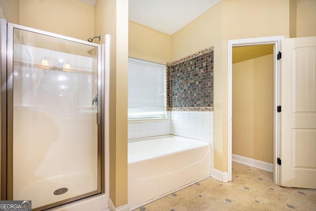 104 Hamilton Lake View Ct, Lagrange, GA 30241 - bathroom with a stall shower, a bath, and baseboards
