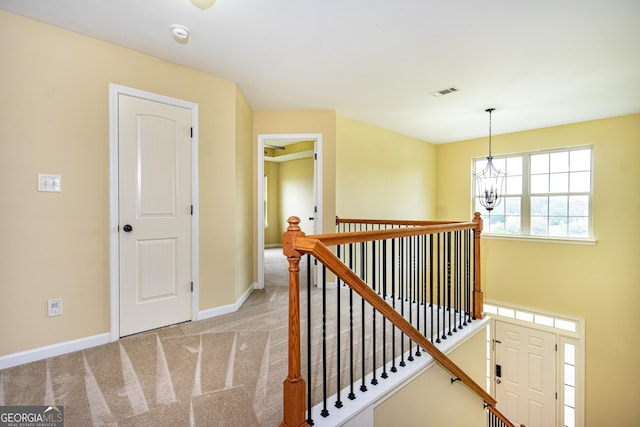 104 Hamilton Lake View Ct, Lagrange, GA 30241 - hall featuring an upstairs landing, a chandelier, light colored carpet, and baseboards
