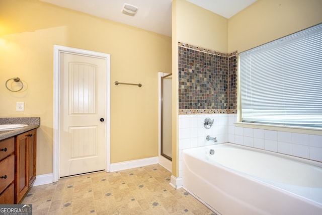 104 Hamilton Lake View Ct, Lagrange, GA 30241 - bathroom with a bath, vanity, a shower stall, and baseboards