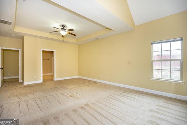 104 Hamilton Lake View Ct, Lagrange, GA 30241 - unfurnished bedroom with a tray ceiling, light carpet, and baseboards