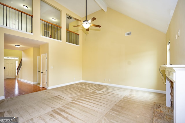 104 Hamilton Lake View Ct, Lagrange, GA 30241 - unfurnished living room with high vaulted ceiling, carpet, ceiling fan, baseboards, and beam ceiling