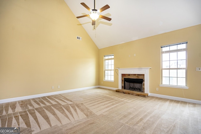 104 Hamilton Lake View Ct, Lagrange, GA 30241 - unfurnished living room featuring high vaulted ceiling, carpet floors, baseboards, a ceiling fan, and a stone fireplace