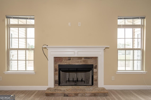 104 Hamilton Lake View Ct, Lagrange, GA 30241 - detailed view of a fireplace with raised hearth, carpet flooring, and baseboards