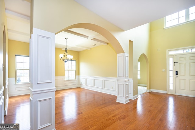 104 Hamilton Lake View Ct, Lagrange, GA 30241 - entrance foyer featuring wood finished floors, plenty of natural light, a chandelier, wainscoting, and beam ceiling